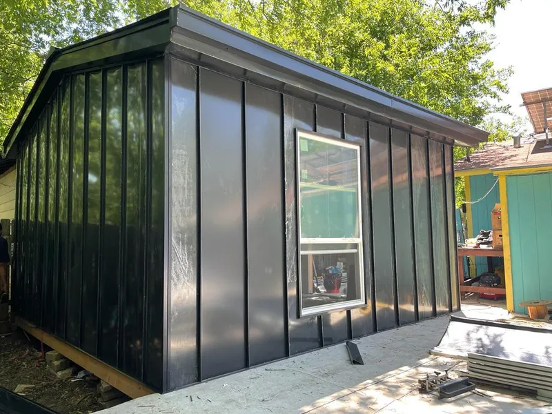 Black standing seam metal wall panels for Roof Inspection in Orange City