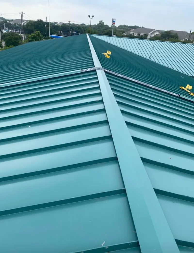 Green commercial metal roof ridge and valley for Metal Roof Repair in Orange City
